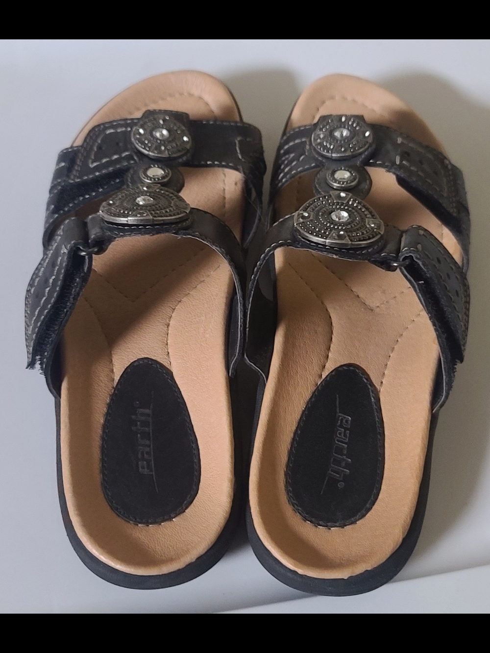 Earth Black Sandals with Tan Footbed and Decorative Medallions